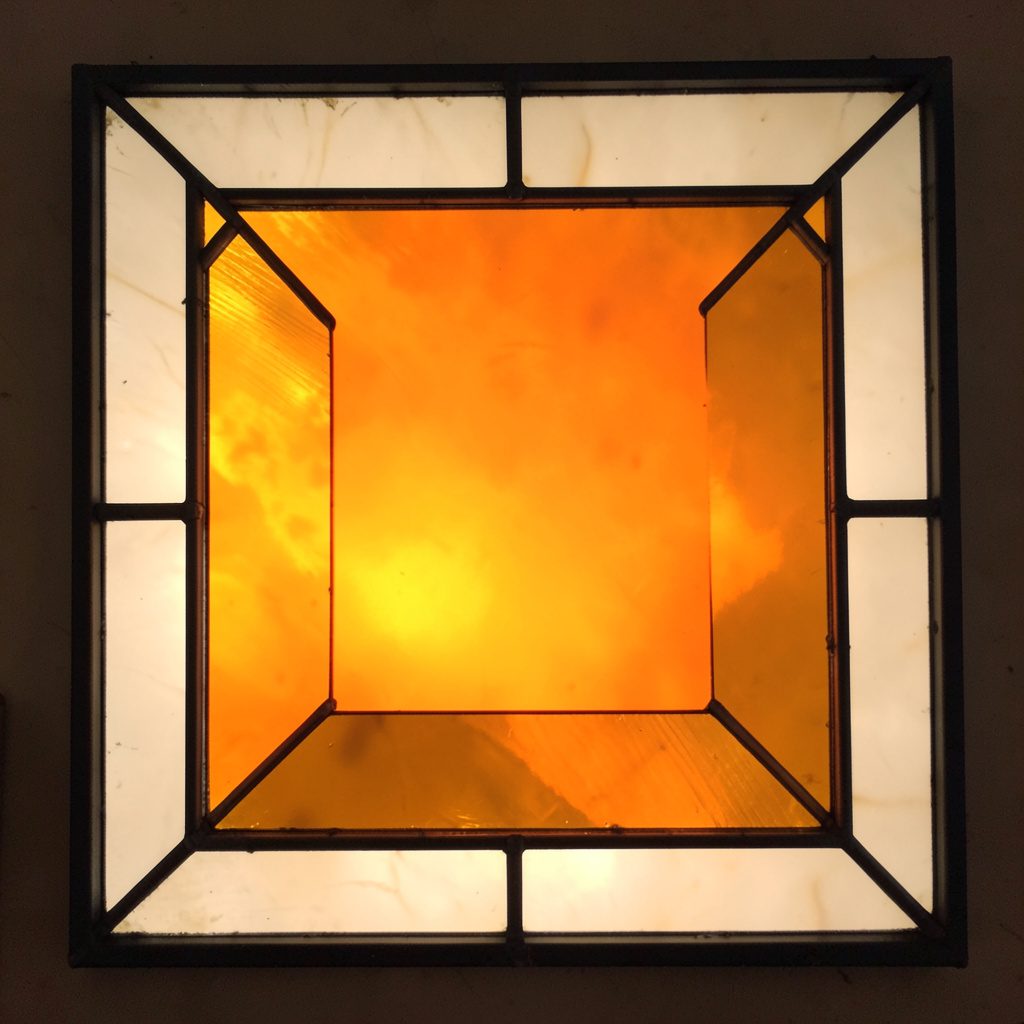 Stained-glass square in ivory and amber, broad leaded borders